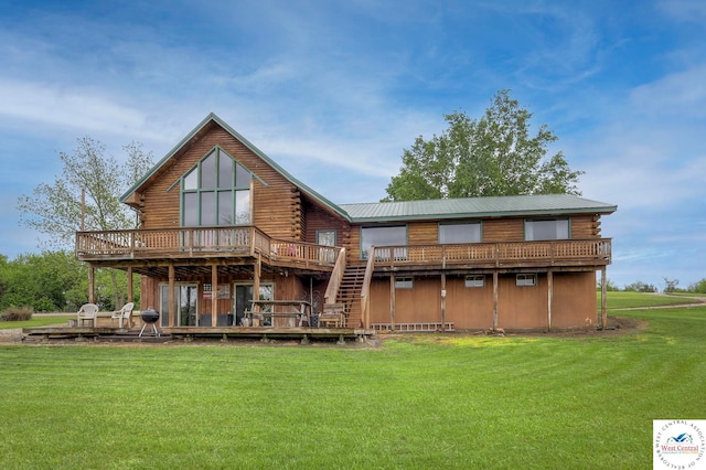 back of property with metal roof, stairs, a yard, a wooden deck, and log exterior