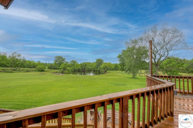 deck featuring a yard, a water view, and view of golf course