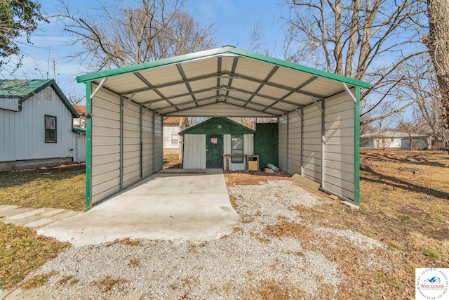 view of shed featuring driveway and a carport