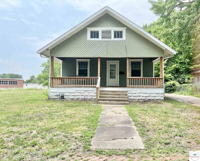 bungalow-style house with a porch and a front yard