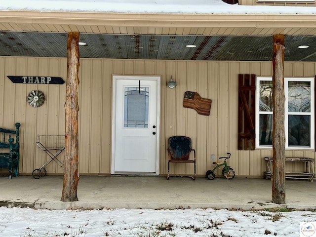 view of snow covered property entrance