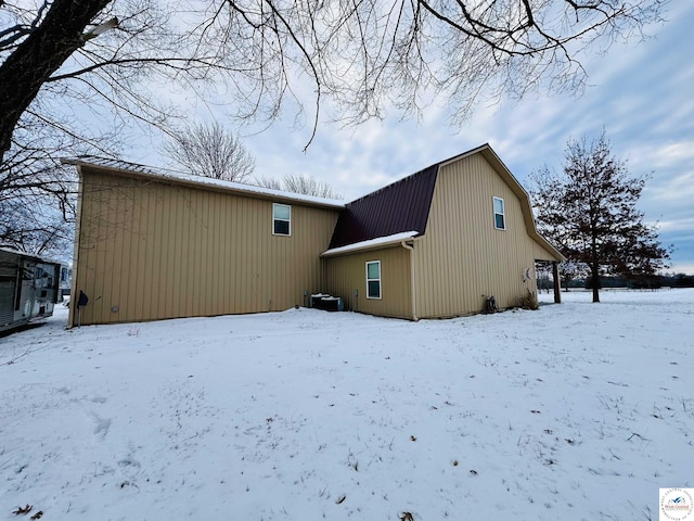 view of front of property featuring a chimney, a porch, board and batten siding, and french doors