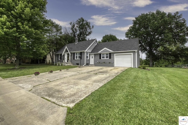 view of front of house featuring an attached garage, a chimney, concrete driveway, and a front yard