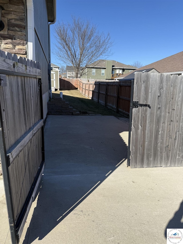 exterior space featuring fence private yard and a gate