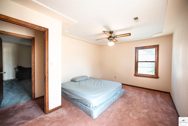 bedroom with a ceiling fan, baseboards, visible vents, and carpet flooring