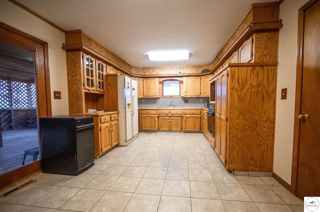 kitchen with brown cabinetry, glass insert cabinets, black electric range, white fridge with ice dispenser, and a sink