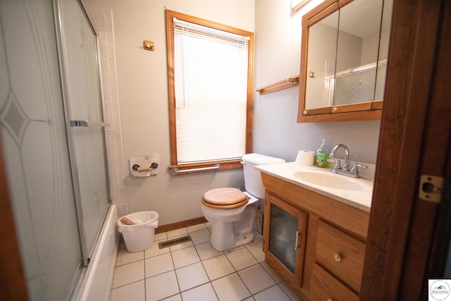 bathroom featuring tile patterned floors, visible vents, vanity, and an enclosed shower