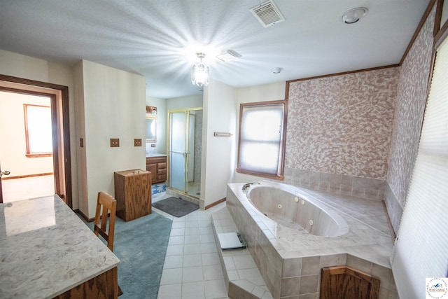 bathroom with visible vents, tile patterned floors, a jetted tub, vanity, and a shower stall