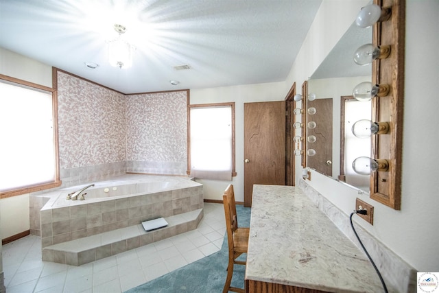 full bath with wallpapered walls, plenty of natural light, visible vents, and a bath