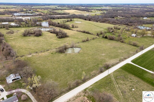 birds eye view of property featuring a rural view