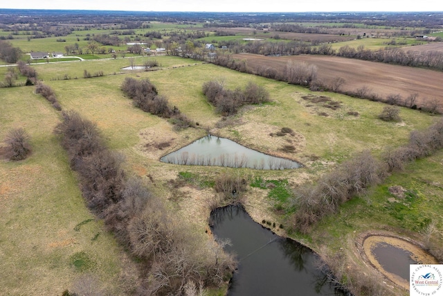 drone / aerial view with a water view and a rural view