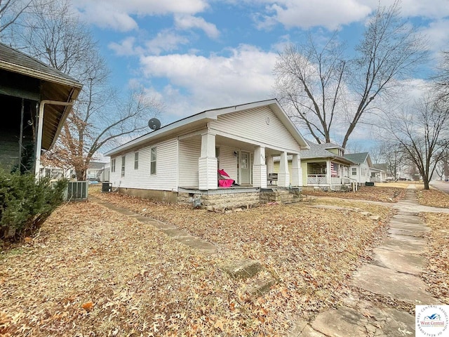 view of front of property with central air condition unit and a porch