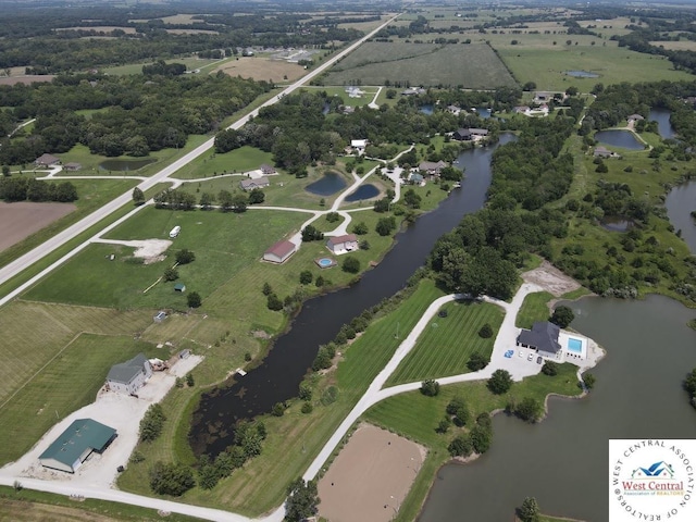 drone / aerial view featuring a rural view and a water view