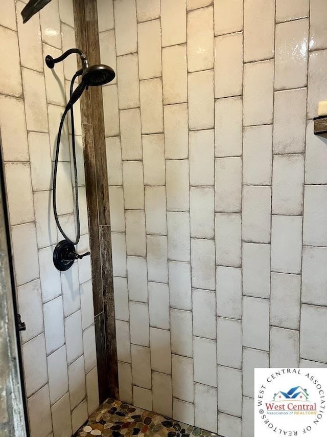 interior space featuring a tile shower