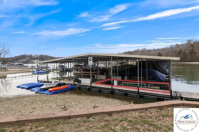 view of dock featuring boat lift and a water view