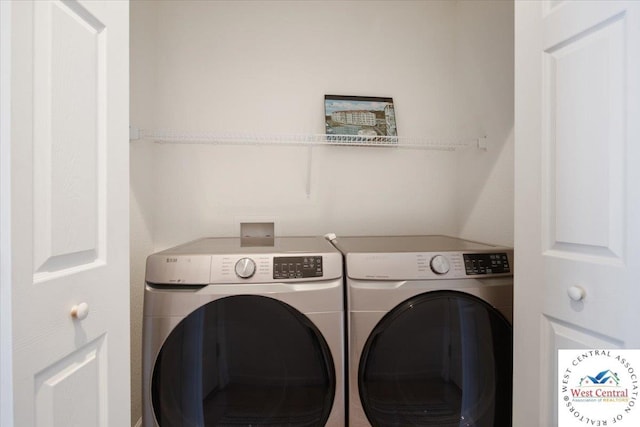 laundry room featuring washer and clothes dryer and laundry area