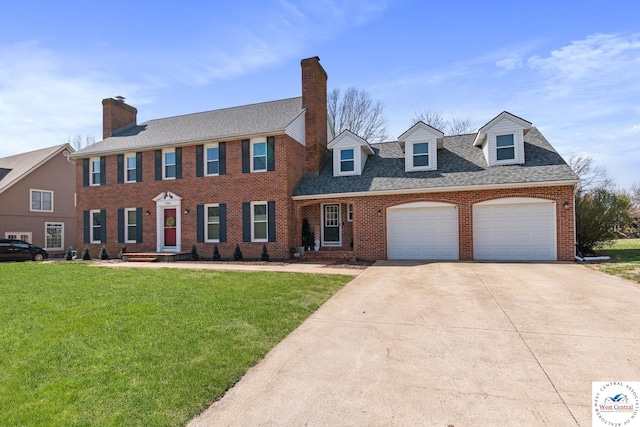 colonial house featuring concrete driveway, brick siding, an attached garage, and a front lawn