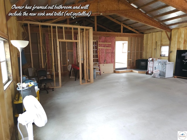 miscellaneous room featuring concrete flooring and washer / dryer