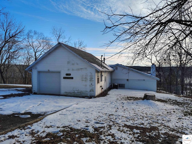 exterior space featuring a detached garage