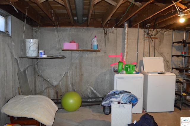 unfinished basement with washing machine and clothes dryer