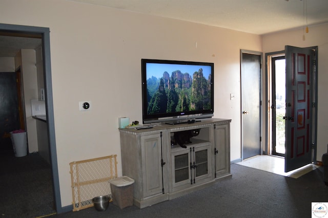 carpeted living room featuring plenty of natural light