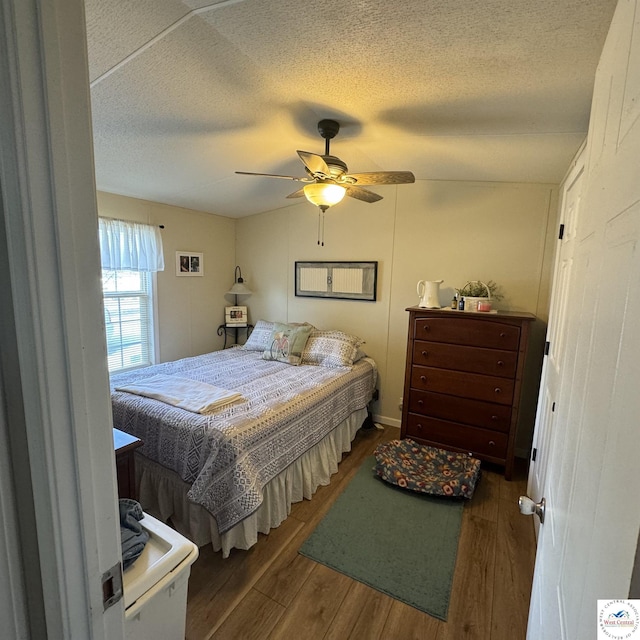 33039 Hilty Ave, Warsaw, MO 65355 - bedroom featuring a textured ceiling, a ceiling fan, and wood finished floors