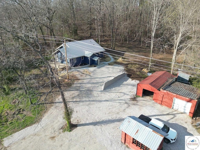 drone / aerial view featuring a view of trees