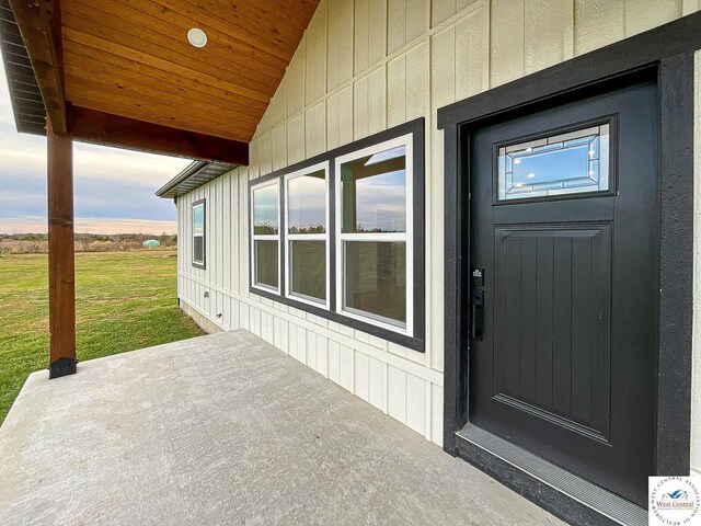 17788 Main Rd, Sedalia, MO 65301 - view of exterior entry with a lawn and a patio