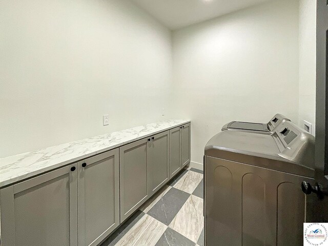 17788 Main Rd, Sedalia, MO 65301 - washroom featuring cabinet space and washing machine and clothes dryer