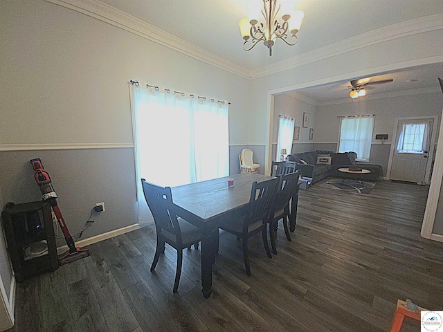 1012 E 7th St, Sedalia, MO 65301 - dining space featuring a chandelier, dark wood-type flooring, crown molding, and baseboards