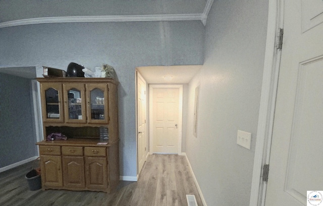 1012 E 7th St, Sedalia, MO 65301 - corridor featuring light wood finished floors, ornamental molding, and baseboards