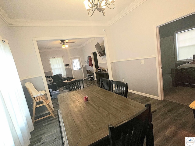 1012 E 7th St, Sedalia, MO 65301 - dining area featuring dark wood finished floors, ornamental molding, a chandelier, ceiling fan, and baseboards