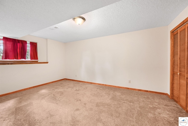 56 NW 247th Rd, Clinton, MO 64735 - unfurnished bedroom with carpet floors, a closet, and a textured ceiling