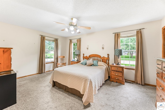 56 NW 247th Rd, Clinton, MO 64735 - bedroom with light colored carpet, ceiling fan, and a textured ceiling