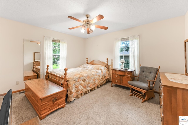 56 NW 247th Rd, Clinton, MO 64735 - bedroom with carpet floors, ceiling fan, and a textured ceiling