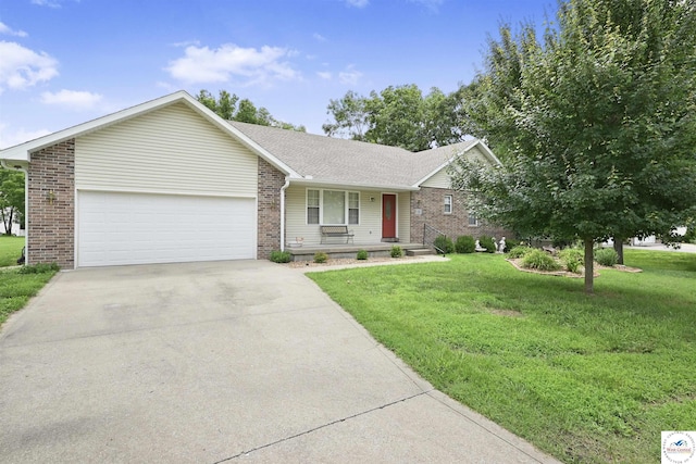 56 NW 247th Rd, Clinton, MO 64735 - ranch-style home with brick siding, an attached garage, concrete driveway, a front lawn, and covered porch