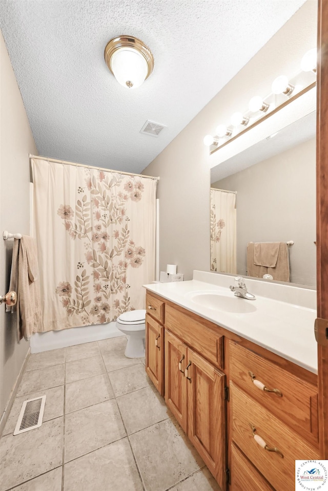56 NW 247th Rd, Clinton, MO 64735 - full bath featuring vanity, a textured ceiling, tile patterned floors, and shower / bath combo