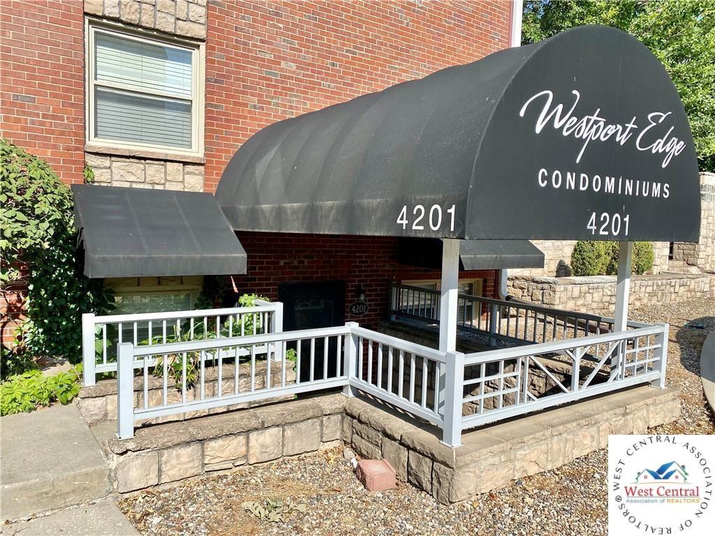 entrance to property featuring brick siding