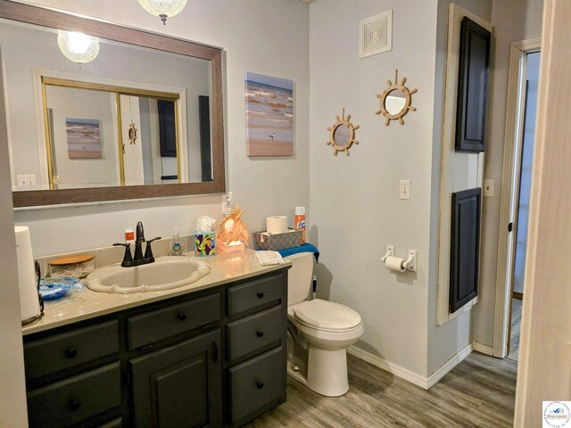 bedroom featuring a ceiling fan, a textured ceiling, and wood finished floors