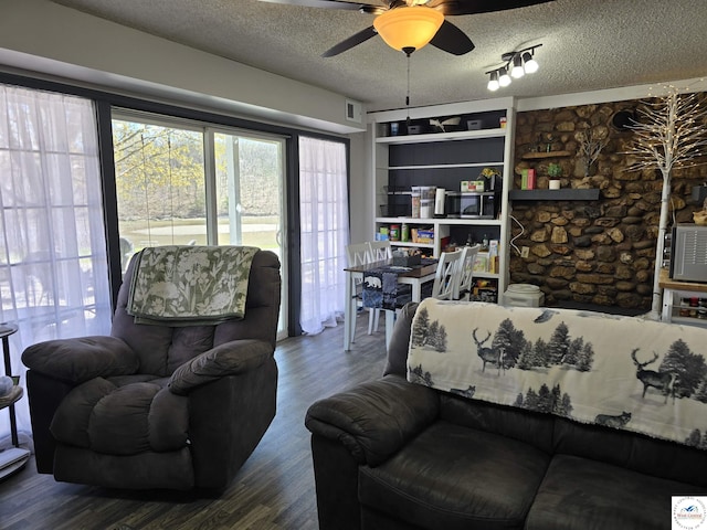 17509 Snowcap Loop, Warsaw, MO 65355 - living area with a textured ceiling, visible vents, wood finished floors, and ceiling fan