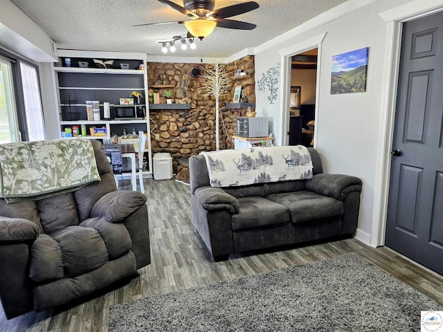 bedroom featuring a textured ceiling, visible vents, and carpet