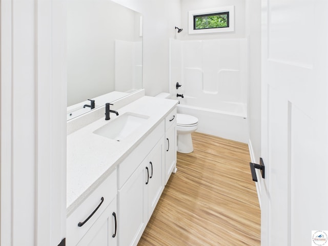 1248 Rich Blvd, Warrensburg, MO 64093 - bathroom featuring vanity, wood finished floors, and shower / tub combination