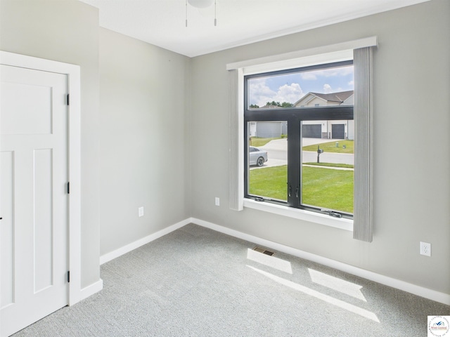 1248 Rich Blvd, Warrensburg, MO 64093 - unfurnished room featuring carpet and a ceiling fan