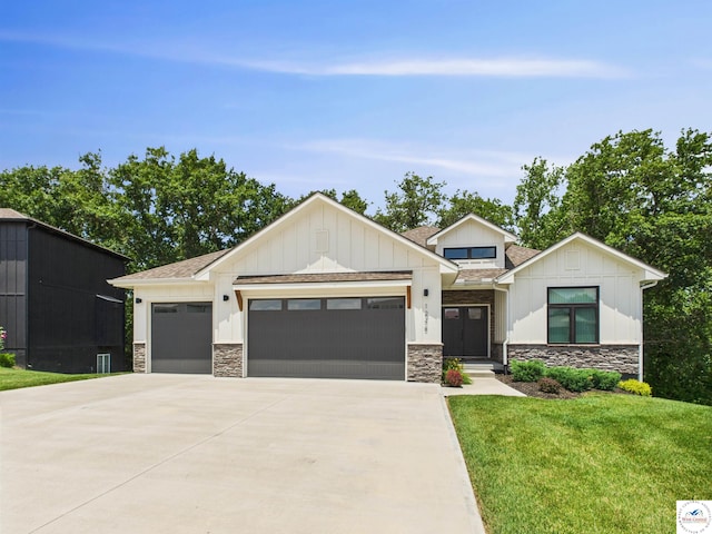 1248 Rich Blvd, Warrensburg, MO 64093 - modern inspired farmhouse featuring a garage, stone siding, driveway, a front yard, and board and batten siding