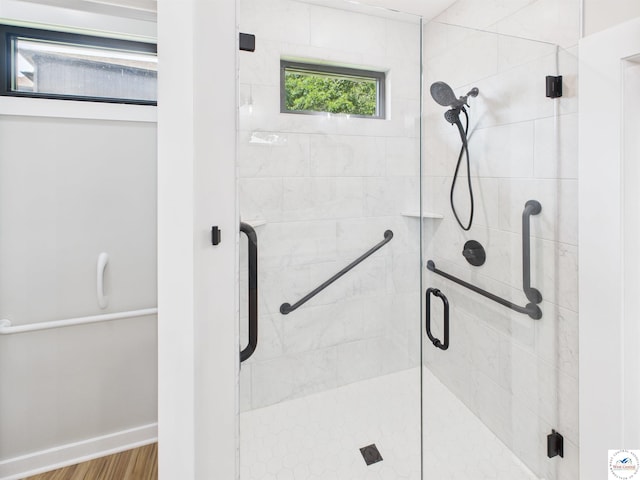 1248 Rich Blvd, Warrensburg, MO 64093 - full bathroom featuring a shower stall and wood finished floors