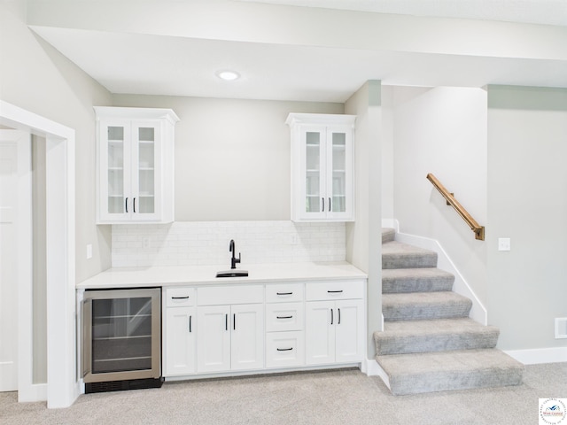1248 Rich Blvd, Warrensburg, MO 64093 - indoor wet bar featuring wine cooler, light colored carpet, tasteful backsplash, stairway, and recessed lighting