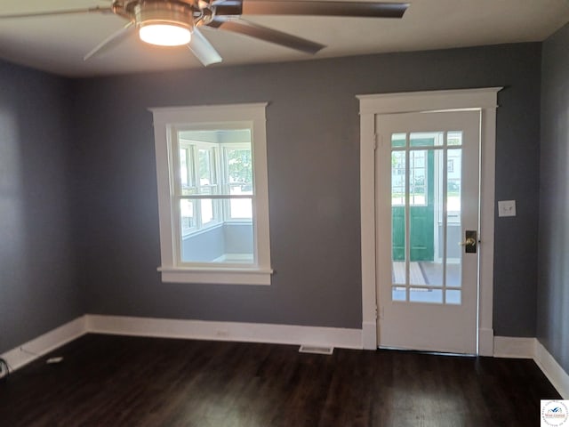501 S Oak St, Versailles, MO 65084 - entryway with dark wood finished floors and ceiling fan