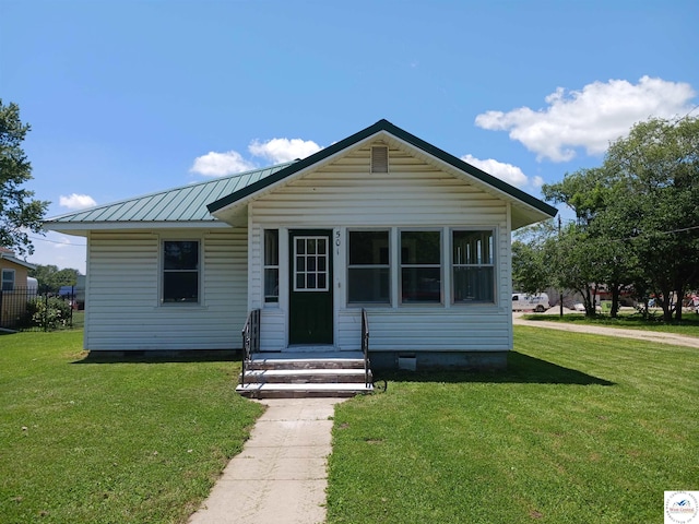 501 S Oak St, Versailles, MO 65084 - view of front of home with crawl space, a front lawn, and a metal roof