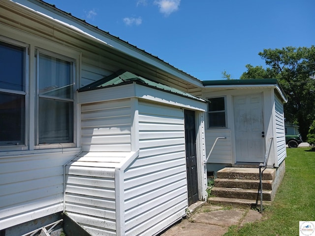 501 S Oak St, Versailles, MO 65084 - view of side of property with entry steps and a metal roof