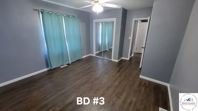 501 S Oak St, Versailles, MO 65084 - unfurnished bedroom with dark wood-style flooring and ceiling fan